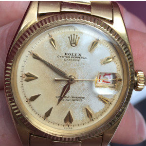 Vintage gold Rolex Datejust with dagger hour markers and roulette date wheel